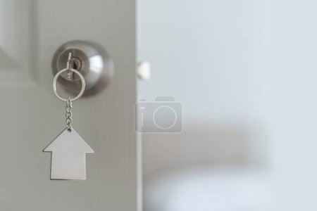 Photo for Close up of key on the door, Open door to a new home with key, property and new home concept with copy space - Royalty Free Image
