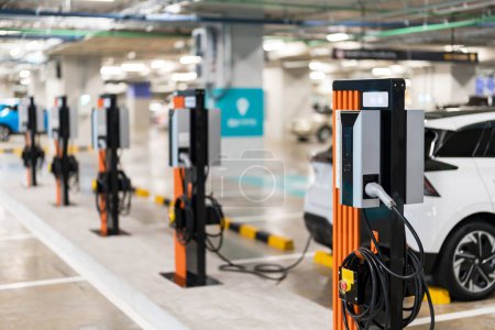 Photo for Charging of electric cars at a charging station, automotive industry, transportation, modern technology - Royalty Free Image