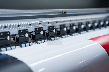 Close-up of large format printer heads in action, Detailed view of modern large format printer heads working on white media