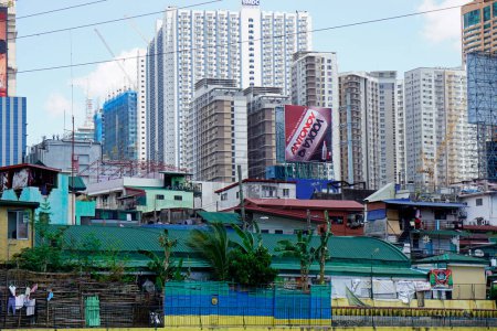 Photo for Manila, philippines, circa March 2023 - modern houses at the pasig river shore - Royalty Free Image