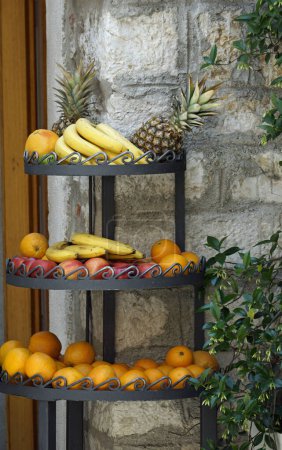 Photo for Etagere with fresh and tasty tropical fruit - Royalty Free Image