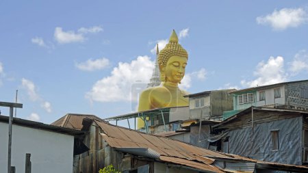 golden buddha statue at chao praya river in bangkok