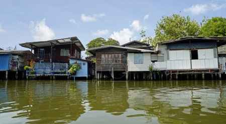 Wooden houses on the chao praya river in bangkok