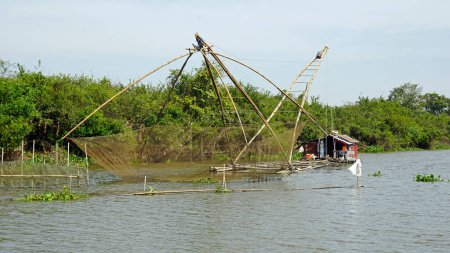 fisherman boat with big net on the tonle sap river in cambodia