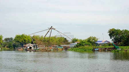 fisherman boat with big net on the tonle sap river in cambodia