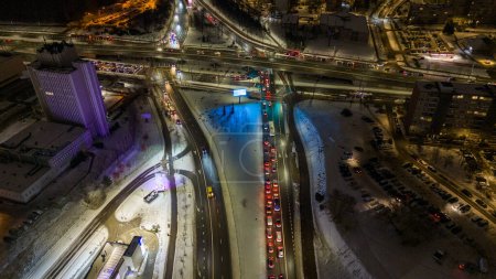 Drone photography of high intensity road in a city during cloudy winter morning rush