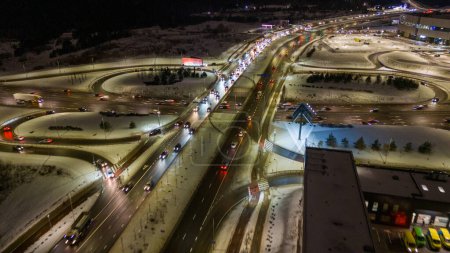 Drone photography of high intensity road in a city during cloudy winter morning rush