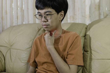 Photo for Little ill boy get sore throat and sickness in inflaming or choking can't breath with unhappy. Medical, healthcare and Allergy concept. - Royalty Free Image