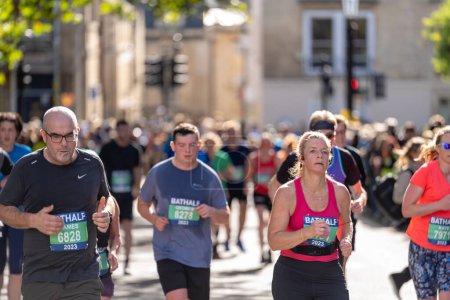 Photo for Bath, UK, October 15, 2023: Runners take part in the Bath Half Marathon at the historic Somerset city - Royalty Free Image