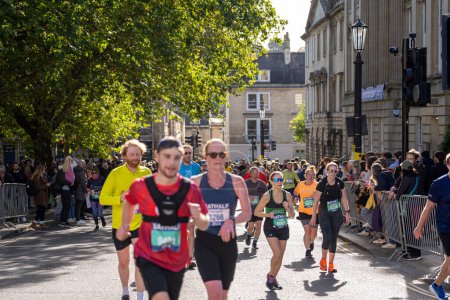 Photo for Bath, UK, October 15, 2023: Runners take part in the Bath Half Marathon at the historic Somerset city - Royalty Free Image