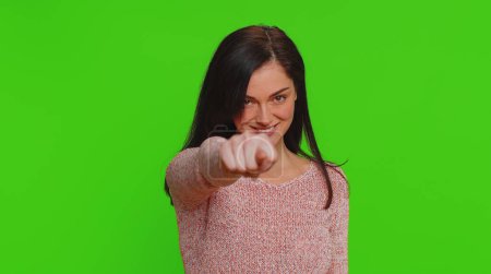 Photo for Angry aggressive pretty woman showing fig negative gesture, you dont get it anyway. Rapacious, avaricious, acquisitive. Body language. Refusal fig sign. Greedy avaricious girl on chroma key background - Royalty Free Image