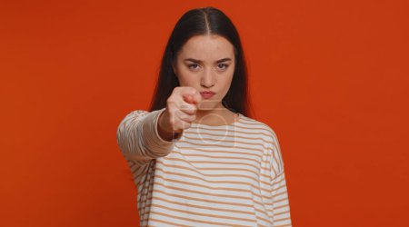 Photo for Angry aggressive pretty woman showing fig negative gesture, you dont get it anyway. Rapacious, avaricious, acquisitive. Body language. Refusal fig sign. Greedy avaricious girl on red background - Royalty Free Image