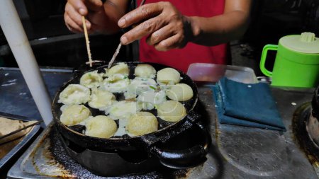 Photo for Process to cooking takoyaki most popular delicious snack at traditional night market - Royalty Free Image