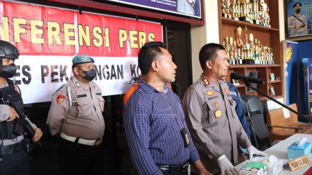 Photo for The perpetrators of the crime being interrogated by members of the police Pekalongan Indonesia March 9 2023 - Royalty Free Image