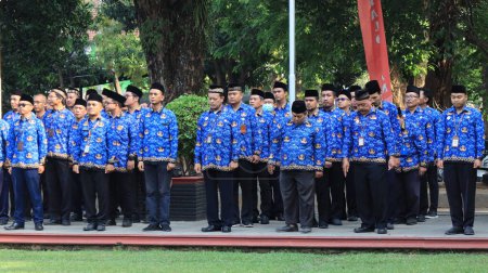 Photo for Indonesian Civil Servants are attending the ceremony wearing Korpri clothes, Pekalongan November 13 2023 - Royalty Free Image