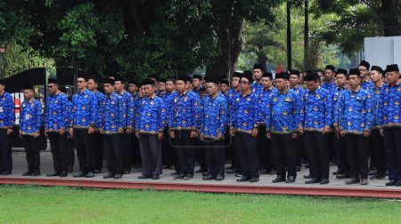 Photo for Indonesian Civil Servants are attending the ceremony wearing Korpri clothes, Pekalongan November 29 2023 - Royalty Free Image
