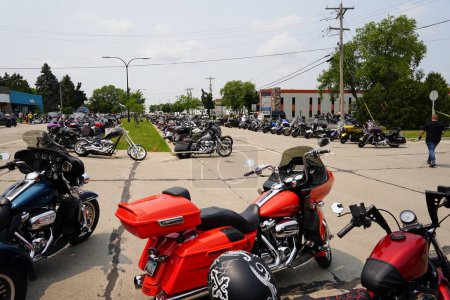 Photo for Greenfield, Wisconsin, USA - July 15th, 2023: Riders of Harley Davidson motorcycles gathered their bikes together on the streets for an rally event at House of Harley Davidson. - Royalty Free Image