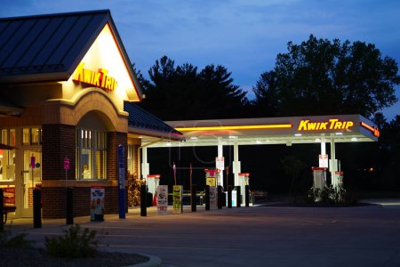 Photo for Wisconsin Dells, Wisconsin USA May 19th, 2023: Kwik Trip fuel station sign glows during the night servicing the community. - Royalty Free Image