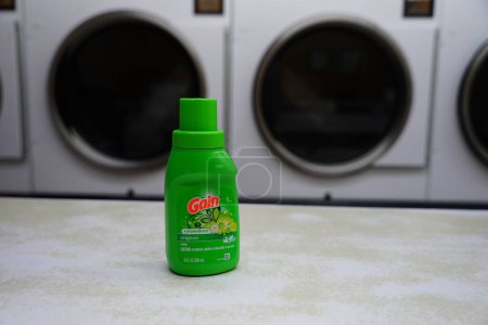 Photo for New Lisbon, Wisconsin USA - February 1st, 2023: Green bottle of 10 fl oz of Gain laundry detergent. - Royalty Free Image