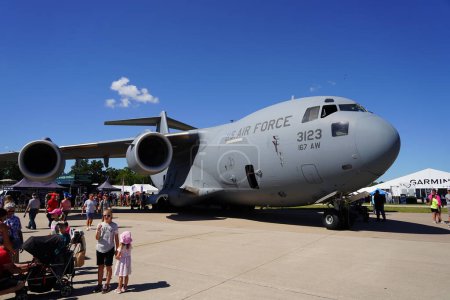 Photo for Oshkosh, Wisconsin USA - July 30th, 2022: Many people gathered at EAA AirVenture Oshkosh to see the USA Military aircrafts. - Royalty Free Image