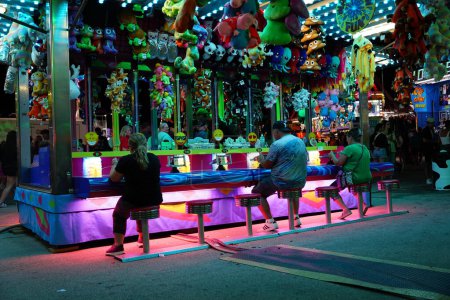 Photo for Fond du Lac, Wisconsin USA - July 21st, 2023: Families came out during the night to enjoy playing fair games. - Royalty Free Image
