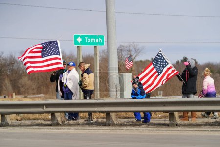 Photo for Oakdale, Wisconsin USA - March 4th, 2022: Pro Americans and pro Trump supporters gathered on I90 and I94 highway overpass waving flags showing support for the Freedom Convoy. - Royalty Free Image