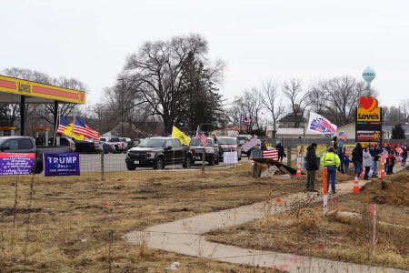 Photo for Oakdale, Wisconsin USA - March 4th, 2022: Pro Americans and pro Trump supporters gathered at Loves Fuel station waving flags and showing support for the Freedom Convoy traveling through Wisconsin. - Royalty Free Image