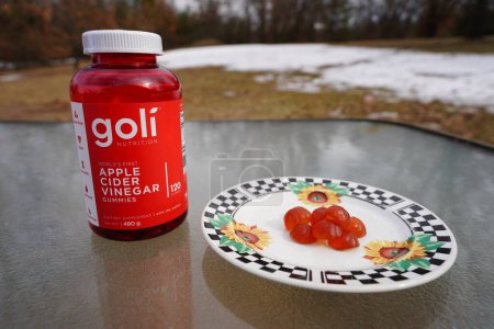 Photo for New Lisbon, Wisconsin USA - March 26th, 2023: 120 count of Goli Nutrition Apple Cider Vinegar Gummies in a red bottle. - Royalty Free Image