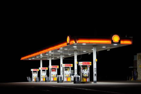 Photo for Tomah, Wisconsin USA - April 15th, 2022: Shell fuel station glowing at night. - Royalty Free Image