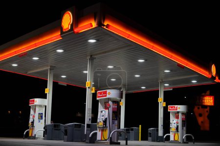 Photo for Tomah, Wisconsin USA - April 15th, 2022: Shell fuel station glowing at night. - Royalty Free Image