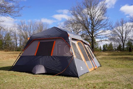 Photo for New Lisbon, Wisconsin USA - May 18th, 2022: Dark Gray Orange trim Ozark Trail 14 x 10 extra large tent. - Royalty Free Image