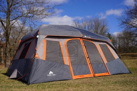 Photo for New Lisbon, Wisconsin USA - May 18th, 2022: Dark Gray Orange trim Ozark Trail 14 x 10 extra large tent. - Royalty Free Image