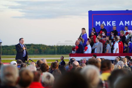 Photo for Mosinee, Wisconsin / USA - September 17th, 2020: Male speakers speak to the president trump supporters during make america great again rally at wisconsin central airport - Royalty Free Image