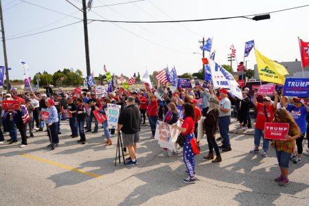 Photo for Manitowoc, Wisconsin / USA - September 21th, 2020: President trump and vice president mike pence supporters and joe biden and kamala harris supporters rallied together outside aluminum foundry. - Royalty Free Image