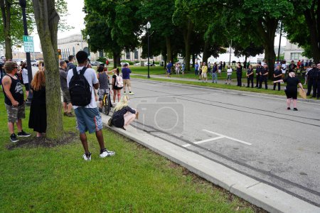 Photo for Kenosha, Wisconsin / USA - June 27th, 2020: BLM supporters and antifa engaged in fighting conflict with supporters at blue lives matter rally while local police kept a divide between both sides. - Royalty Free Image