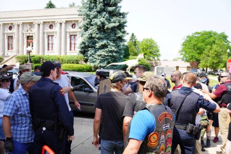 Photo for Kenosha, Wisconsin / USA - June 27th, 2020: BLM supporters and antifa engaged in fighting conflict with supporters at blue lives matter rally while local police kept a divide between both sides - Royalty Free Image