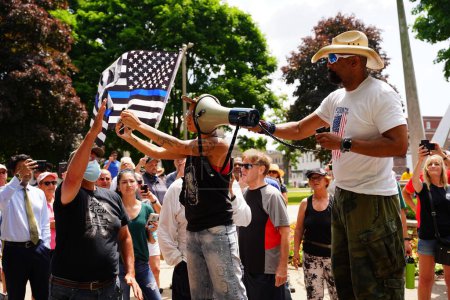 Photo for Kenosha, Wisconsin / USA - June 27th, 2020: Black lives matter and antifa member disrupted milwaukee County Sheriff David A. Clarke Jr speech at blue lives matter rally. - Royalty Free Image