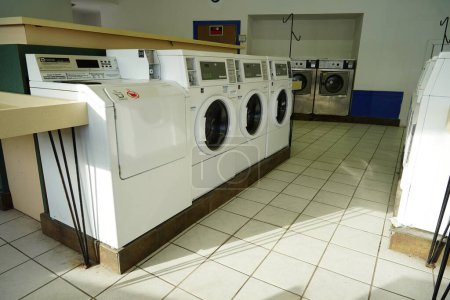 Photo for New Lisbon, Wisconsin USA - January 29th, 2023: Empty public laundromat. - Royalty Free Image
