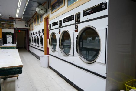 Photo for New Lisbon, Wisconsin USA - January 29th, 2023: Empty public laundromat. - Royalty Free Image