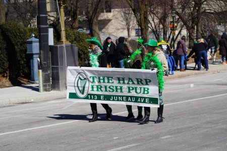 Photo for Milwaukee, Wisconsin USA - March 12th, 2022: Members of the St. Patrick's Day parade dressed up in Leprechaun costumes to celebrate the holiday. - Royalty Free Image