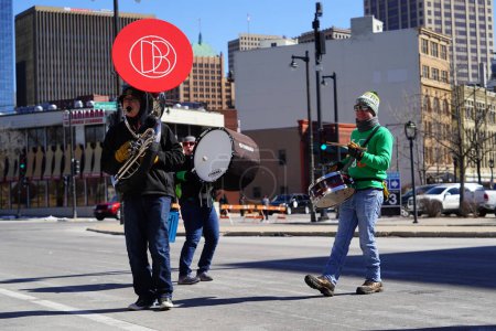 Photo for Milwaukee, Wisconsin USA - March 12th, 2022: Irish street band walked and played music in St. Patrick's Day parade. - Royalty Free Image