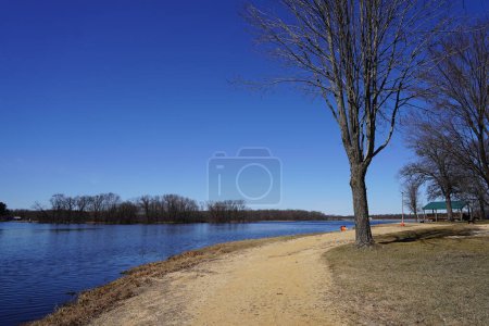 Photo for Dirt walking path along a lake during early spring. - Royalty Free Image