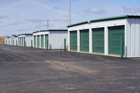 Photo for Green door storage units for the community to use. - Royalty Free Image