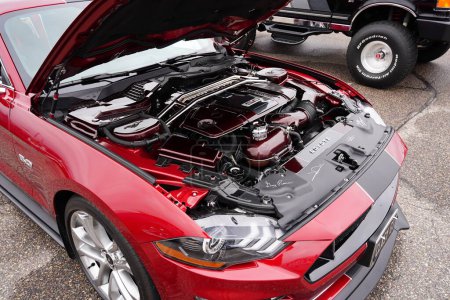 Photo for Baraboo, Wisconsin USA - April 30th, 2022: 2018 5.0 Red Ford Mustang Coyote being shown off at Cruise for a Cause outside car show. - Royalty Free Image