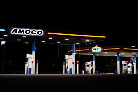 Photo for Tomah, Wisconsin USA - May 12th, 2023: Amoco fuel station glows during the night servicing the community. - Royalty Free Image