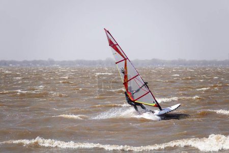 Photo for Fond du Lac, Wisconsin / USA - May 3rd, 2020: Locals from Fond du Lac and out of state members enjoyed windsurfing and kitesurfing out on Winnebago Lake went against safer at home coronavirus pandemic - Royalty Free Image