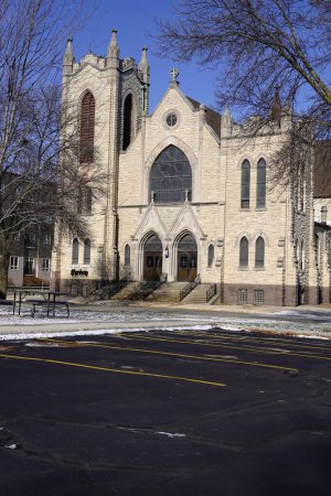 Photo for Fond du Lac, Wisconsin USA - December 10th, 2019: Old catholic church building stands as Fond du Lac's history during the winter. - Royalty Free Image