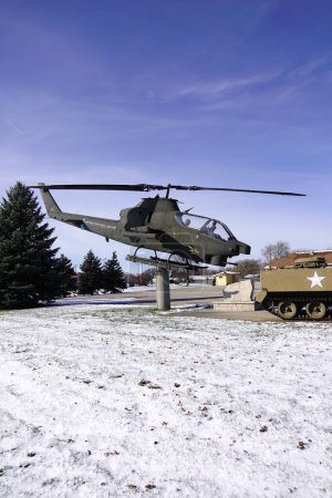 Photo for Prairie Du Sac, Wisconsin / USA - April 11th, 2020: Bell UH-1A huey United States American war helicopter stands mounted at memorial site outside of Prairie Du Sac. - Royalty Free Image