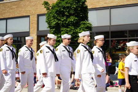 Photo for Sheboygan, Wisconsin / USA - July 4th, 2019: Young youth navy coast guard sea cadets marching in formation in 4th of july freedom pride independence day parade - Royalty Free Image