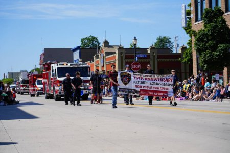 Photo for Sheboygan, Wisconsin / USA - July 4th, 2019: Sheboygan firefighters and fire department rescue engine trucks participated in 4th of july freedom pride parade. - Royalty Free Image